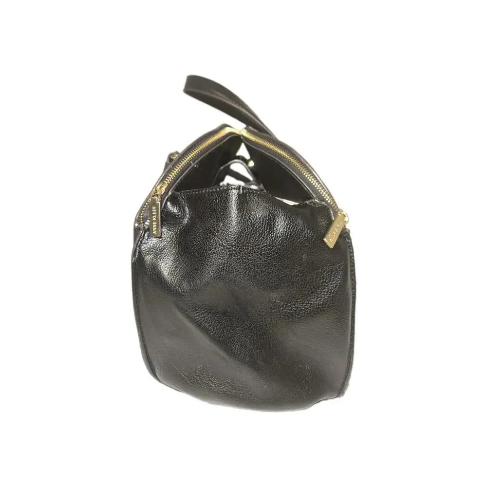 Anne Klein opens has top